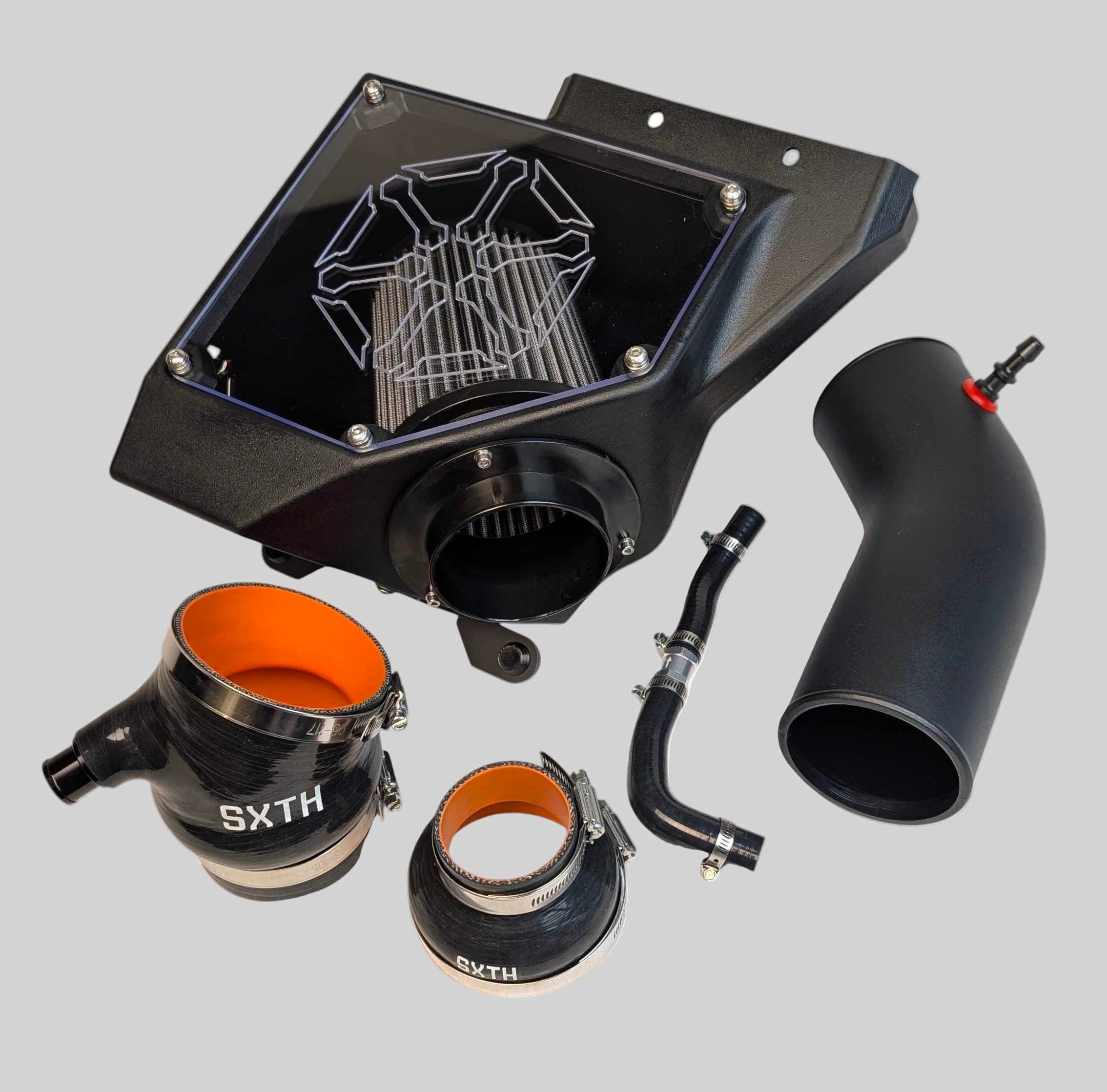 Car air intake system components on a white background